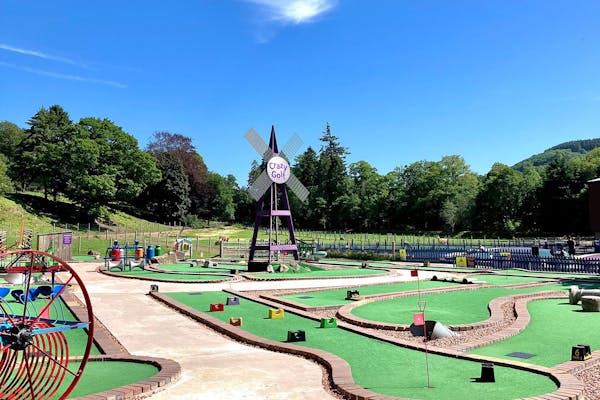 Crazy golf hole with a decorative windmill obstacle on the 18-hole course